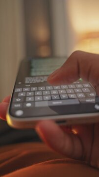 Man hands chatting and typing on smartphone macro closeup. Unrecognizable human typing text message tapping touchscreen keyboard using whatsapp application a social media