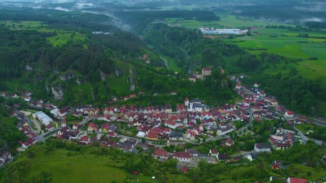 Aerial view of the city Pottenstein in Germany, Bavaria on a cloudy day in Spring