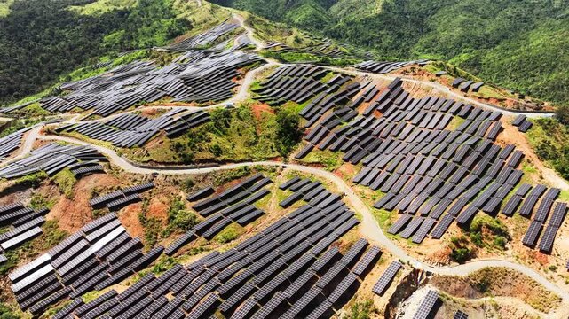 Gigantic solar farm spreads across hills symbolizing electrified future
