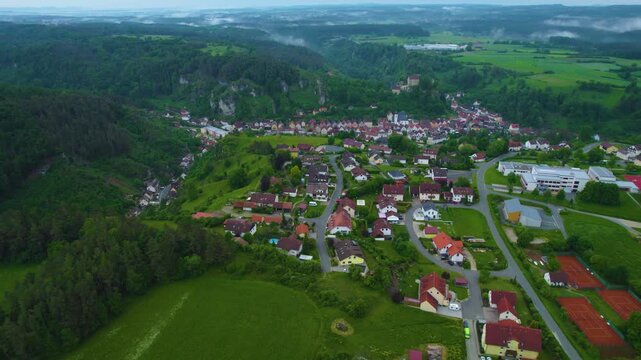 Aerial view of the city Pottenstein in Germany, Bavaria on a cloudy day in Spring