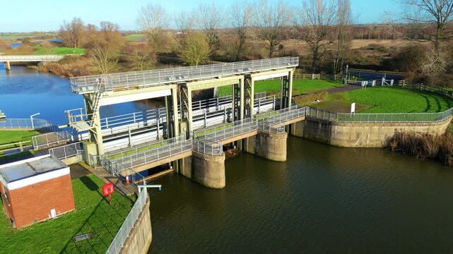 Aerial view of the intricate Denver Sluice network showing the convergence of major rivers and the massive steel gates regulating water flow in the UK