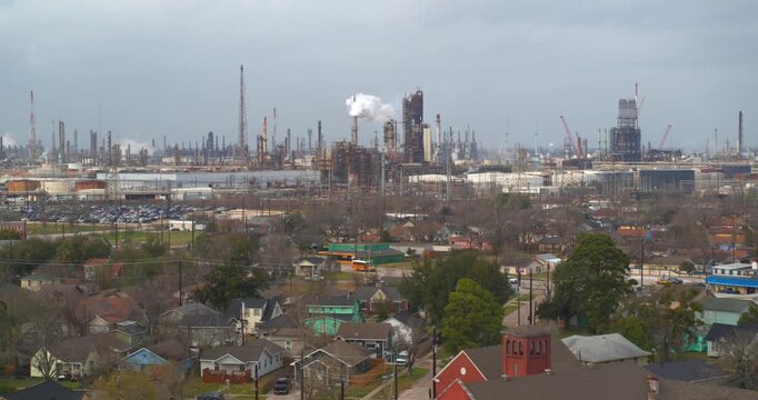 Drone footage revealing petrochemical refineries and smokestacks visible from Baytown residential neighborhoods