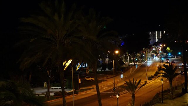 Dark and windy winter night in Palma de Mallorca, Spain. Gabriel Roca Avenue on the seafront.