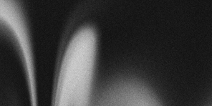 A minimalist monochrome abstract background with soft gradient light and shadow, featuring a grainy texture and subtle noise effect. 