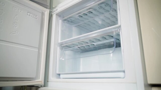 Empty freezer compartment of refrigerator close-up