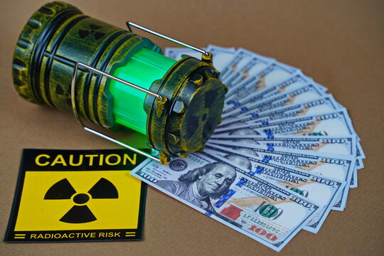 A nuclear reactor. A lamp-figurine with a symbol of radioactivity and dollars.