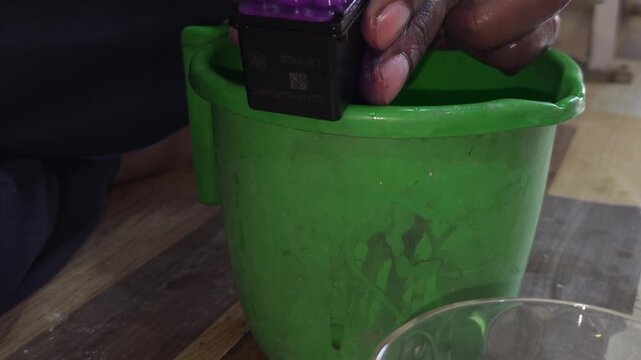 Technician Cleaning Inkjet Printer Head Close Up, Printer Repair and Maintenance Process.