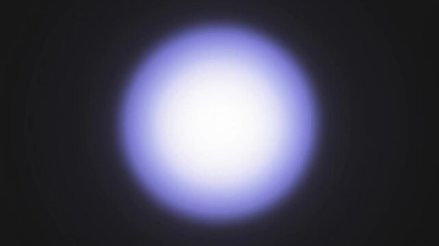 Close-up of a bright white circle with a blue gradient border against a black background with a white lower section.