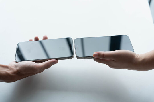 Man using smartphone close contect transfer file by wireless technology