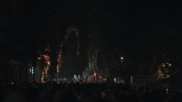 Ogoh Ogoh festival in Bali Indonesia at night with traditional parade, fire, smoke and crowd during Nyepi celebration