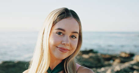 Smile, travel and portrait of woman at beach for summer vacation, relax and tropical adventure. Happiness, weekend break and getaway trip with female person outdoor for tourism, island and coastline