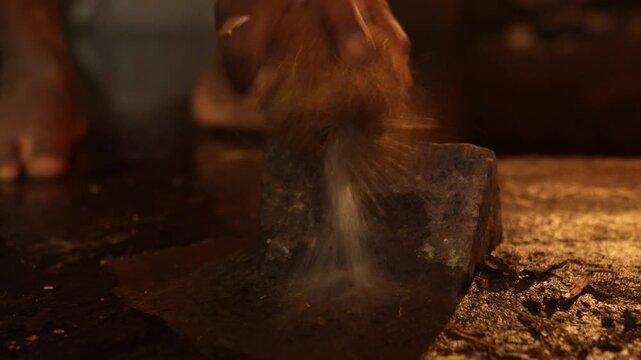 Closeup of Breaking Coconut on Stone in Hindu Temple &ndash; Sacred Ritual Offering.
