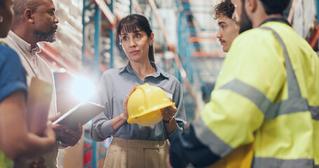 Logistics, team and safety meeting with helmet for PPE compliance, injury prevention and flare. People, warehouse supervisor and discussion with hardhat for OSHA regulations, hazard reporting or risk © peopleimages.com