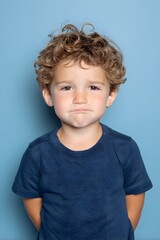 Naklejka premium cute kid looking camera friendly expression bright minimal background
