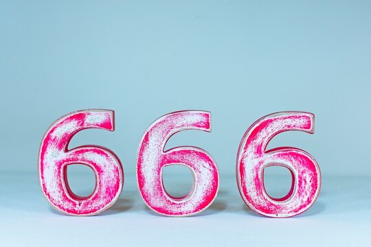  The number 666 on a white background for abstract graphic design. A symbol of the number of the beast in the Book of Revelation in the holy Christian bible, King James version.,