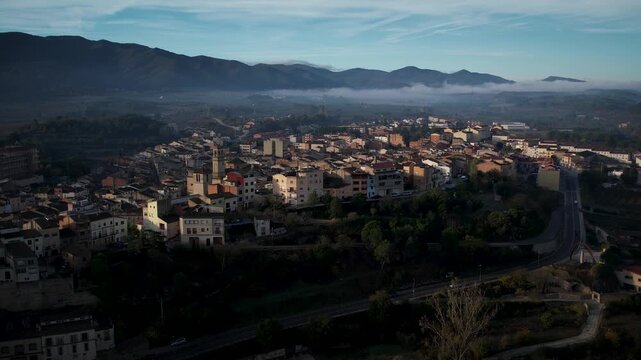 Footage of Espluga de Francoli town in Catalonia with sunrise and mountains in the back. High quality 4k drone footage