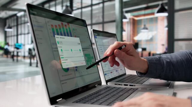 Financial Analyst Works On Laptop Analyzing Corporate Cashflow