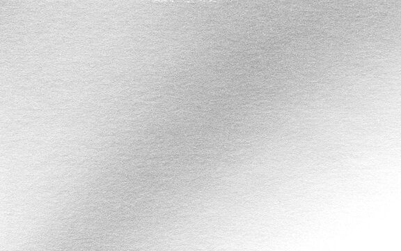 Silver background foil leaf metallic texture wrapping paper shiny glowing white grey solid reflective gradient color metal pattern backdrop for wallpaper decoration element backdrop
