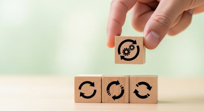 Hand placing wooden block with gear and arrow for business process aspect ratio 16-9