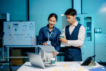 Business professionals reviewing financial reports, signing documents, and analyzing data together,...