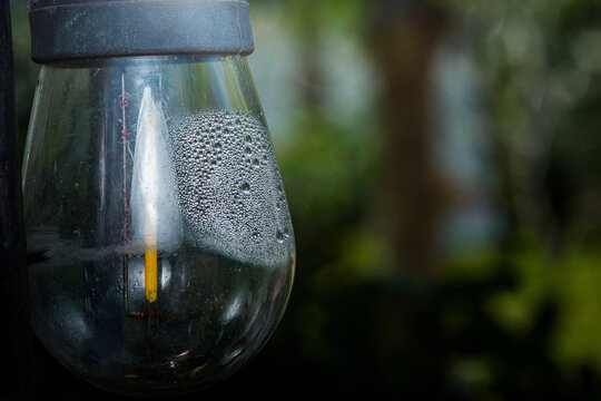 Condensation forming inside outdoor lamp glass globe
