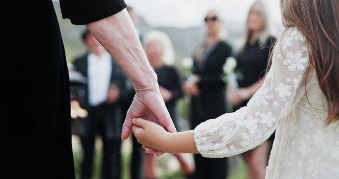 Holding hands, grandmother or girl in graveyard, back or emotion for grief, bereavement or healing. Family, back or grandkid with support for funeral, people or burial for death, sad or compassion