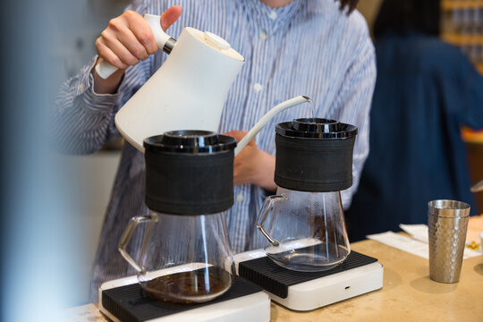Barista preparing fresh coffee in cafe