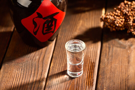 Chinese baijiu shot glass on wooden table