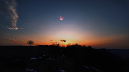 Fototapeta premium Full Moon, stars and planets above landscape silhouettes.