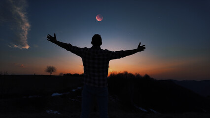 Fototapeta premium Amateur astronomer enjoying observing stars, planets, Moon and other celestial objects.