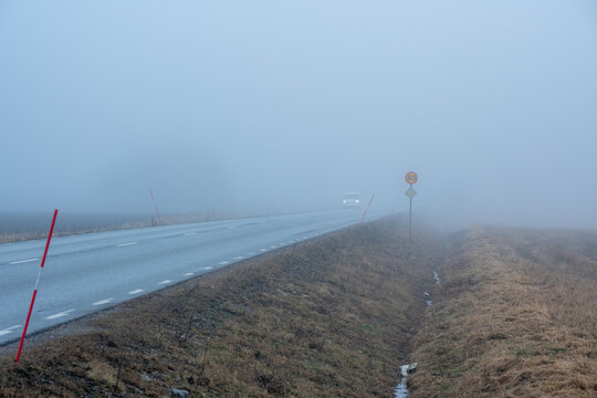 Poor visibility due to mist over rural road