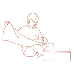 Obraz premium boy folding clothes while sitting on the floor.eps