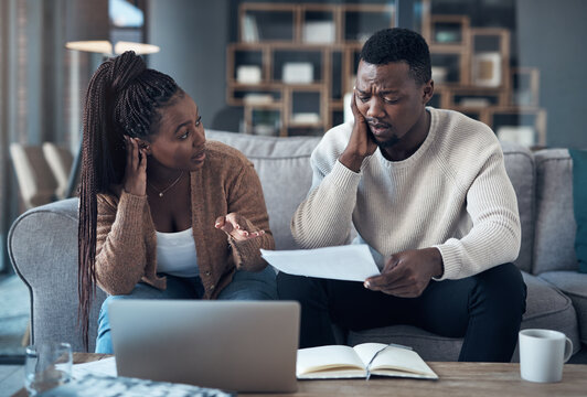 Lounge, paperwork and couple with laptop, sad and disappointed with home loan rejection and talking. Unhappy, black people and budget with partner for mortgage, bad news and asset management in house