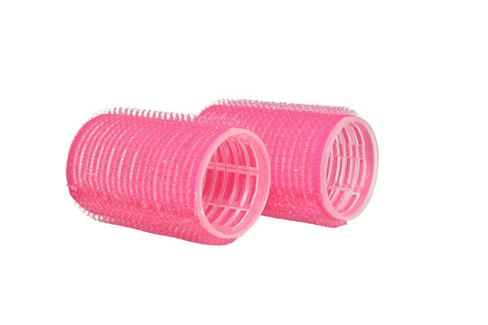Pink Velcro hair curlers isolated on white background.