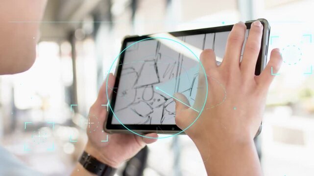 Designer holding tablet in office, tapping sketch and pinching to edit layout with HUD tracking