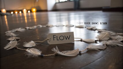 Fototapeta premium Serene Flow Art Installation with Feathers and Inspirational Message in a Calm Indoor Space