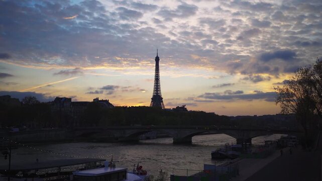 Paris Eiffel Tower in France at sunset seen from Bridge