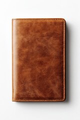 Fototapeta premium Brown leather notebook on white background, closed, textured cover and minimalist design
