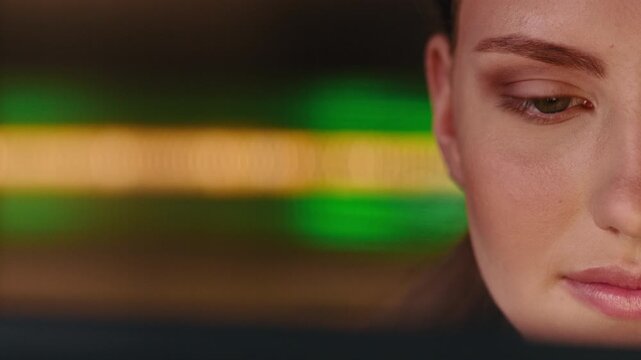 Programming, woman and computer in office at night for app testing, backend script and debugging. Space, coder and reading tech for system update, site maintenance and software development deadline