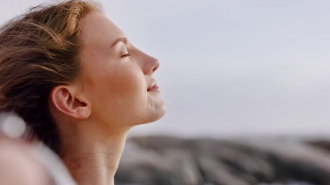 Wind, thinking and woman with mindfulness at beach, remember memory and reflection for holiday peace. Space, summer break or calm person with fresh air for vacation mindset, daydream or perspective