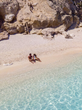 Breathtaking beach moments in Baunei, Sardinia showcasing crystal-clear waters and golden sands