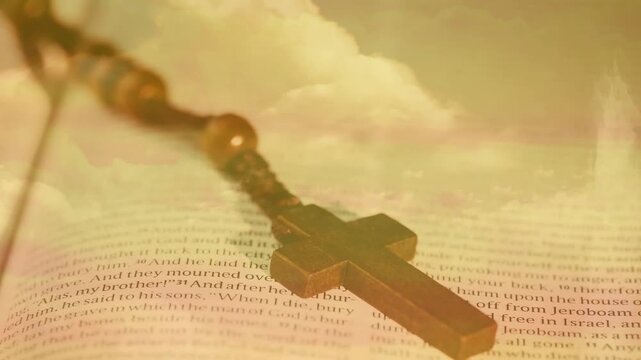 Vertical video: Push zoom and overlay drifting, cross resting on Bible pages, evoking reverence