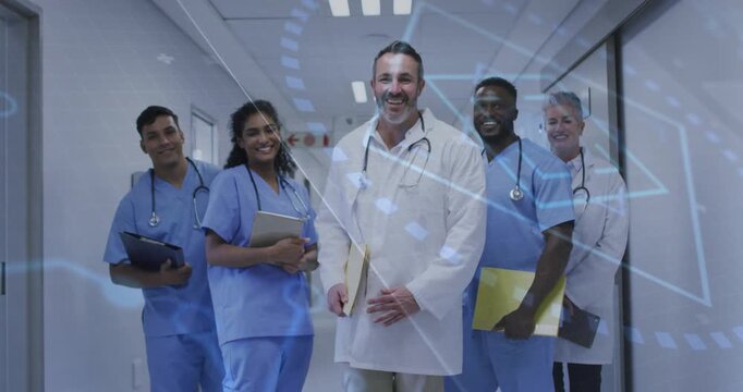 Lead doctor stepping, leading medical team down corridor for rounds, circuit overlay spanning group