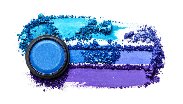 A makeup palette featuring a bright blue eyeshadow with swatches of varied shades