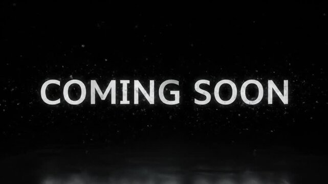 Modern cinematic text reveal displaying COMING SOON in bold stylish typography the letters emerge softly from darkness with smooth fade in and glowing outline subtle particle sparkles drift around the