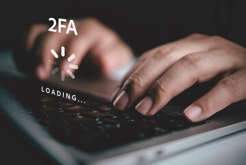 Hands typing laptop keyboard 2FA two factor authentication loading screen graphic overlay....