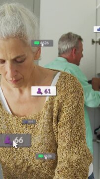 Vertical video: Woman folding shirt for laundry while man sorting nearby causing counts to rise