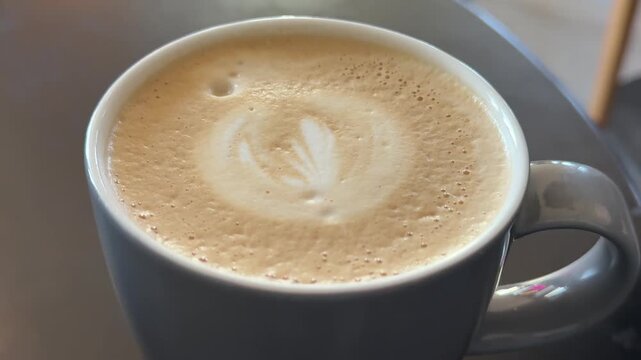 Cup, latte art and above in cafe, service and hospitality with cafeteria, caffeine and french roast. Empty, restaurant and business with creativity, beverage and espresso with industry and product.