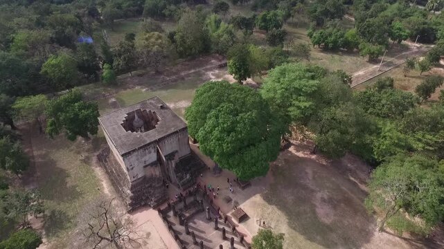 Aerial view of Wat Si Chum temple with the iconic giant seated Buddha statue in Sukhothai Historical Park, Thailand.