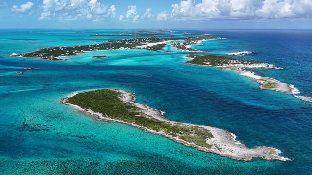Staniel Cay At Exuma In Black Point Bahamas. Seascape Skyline. Shades Of Blue Landscape. Summer Travel. Staniel Cay In Exuma In Black Point Bahamas. Highrise Buildings.